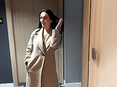 Beautiful stepmom shares a sofa with her stepson in a hotel